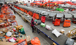 Staff members are sorting deliveries at Daodjia Express Co LTD in Enshi Prefecture, Centra...