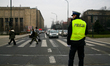 Police are directing traffic during the march through the city streets as part of the cele...