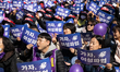 Hundreds of female workers are attending the rally for the International Women's Day strik...
