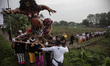 Balinese Hindu devotees are parading Ogoh-ogoh during the Tawur Kesanga ritual at the Para...