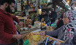 People are purchasing a variety of bread at a market on the first day of Ramadan in Srinag...