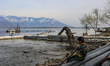 Members of the fishing community are watching the dredging and de-silting work in Wular La...