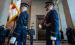 Capitol Police officers salute the American flag as the colors are carried by miltary hono...
