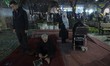 Iranian worshippers are praying on a sidewalk in downtown Tehran during an Iftar ceremony...