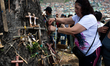 People are taking part in the Good Friday procession in the Ciudad Bolivar locality as par...