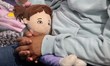 In Ecatepec, Mexico, on April 2, 2024, a child is holding a doll while participating in a...