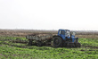 A tractor is being seen in the field where the MinesEye unmanned system for the detection...