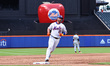 Pete Alonso #20 of the New York Mets is rounding the bases after hitting a game-tying home...