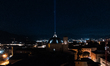 A blue light beam faced to the sky and San Bernardino church dome are seen in an aerial vi...