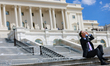 A man views the solar eclipse from the grounds of the U.S. Capitol in Washington, D.C. on...