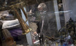 An Iranian trader is sitting at his antique shop in the Grand Bazaar in southern Tehran, I...