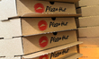 Pizza Hut logos are seen on boxes in Krakow, Poland on April 20, 2024. 