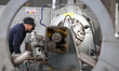 A worker is producing new material products at a new material processing enterprise in Fuz...