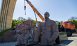 Workers are dismantling the monument commemorating the Pereiaslav Agreement under the Arch...