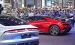 Spectators are looking at the U7 and U9 electric cars at the 2024 Beijing International Au...