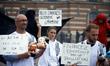 An activist is holding a placard that reads 'Hello Darkness - Goodbye Youth' in Toulouse,...
