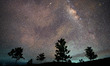 A flight-illuminated path and the Milky Way are appearing in the night sky during the Eta...