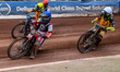 Ben Cook of Belle Vue Aces, in blue, is leading Tom Brennan of Birmingham Brummies, in whi...