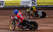 Connor Mountain of Belle Vue Aces, in blue, is riding inside Wiktor Lampart of Birmingham...