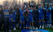 Soccer players, technical staff, and staff members of Sliema Wanderers are celebrating aft...