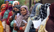 Women voters are queuing to cast their votes during the fourth phase of voting in India's...