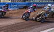 Maciej Janowski of Oxford Spires, in white, is riding inside Belle Vue Aces' Dan Bewley in...
