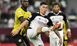 Andres Villa (R) of Al Sadd SC and Ben Malango Ngita (L) of Qatar SC are battling for the...