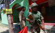 An Indian paramilitary trooper is standing alert during the 6th phase of the Lok Sabha Ele...