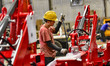 Workers are assembling and producing at a workshop of a loader manufacturing enterprise in...
