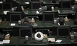 An Iranian lawmaker is sitting in the Parliament hall during an inauguration ceremony of t...