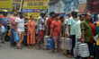 Residents are queuing up to purchase drinking water jars in Siliguri, India, on May 30, 20...