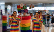 People are dressing in rainbow flag attire and handing out free water while Thailand's Pri...