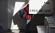 A person is casting their vote for the elections in Mexico, near their home in San Andres...