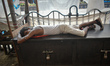 A person is sleeping on a roadside stall during the hot summer day in Kolkata, India, on J...