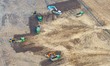 Workers are digging and cleaning the Huaihe River channel at the construction site of the...