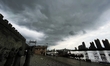 A photo is showing the banks of the Songhua River under dark clouds in Jilin City, Jilin p...