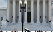 An elderly man is fainting in front of the Supreme Court today as temperatures in Washingt...