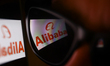Alibaba logo displayed on a phone screen and reflected on sunglasses is seen in this illus...