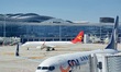 A passenger plane is sliding into the parking stand at the T2 terminal of Yantai Penglai I...