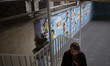 An Iranian woman is arriving at a school that is being used as a polling station to cast h...