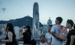 People are looking at the Hong Kong skyline in Hong Kong, China, on July 3, 2024. 