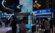 Visitors are visiting the China Mobile stand at the World Artificial Intelligence Conferen...