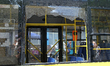 A smashed window is in a trolleybus near the Lukianivska metro station during a Russian mi...