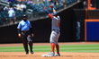 Juan Yepez #18 of the Washington Nationals is gesturing to teammates after doubling during...