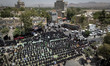 Iraqi men and women living in Iran are praying during a religious festival to commemorate...