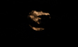 The July full moon, known as the Buck Moon, partially covered by clouds, rises over Otrant...