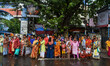 A crowd of people is waiting for transport in Kolkata, India, on July 22, 2024. 