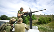 A fighter of the Separate Anti-Aircraft Machine Gun Battalion, who is providing air cover...