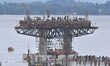 Workers are working on the construction of a bridge over the Brahmaputra River in Guwahati...