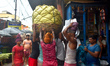 Labours are working inside a market in Kolkata, India, on July 28, 2024. 